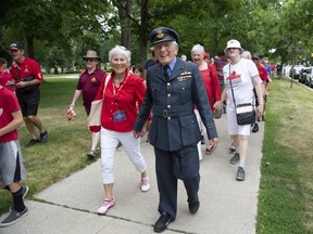 Accompanied by his wife Joyce Hetherington and scores of supporters, 100-year-old Tom Hennessy walks the last mile of his 100-mile trek to raise money for homeless veterans  in London on Friday July 1, 2022. (Derek Ruttan/The London Free Press)