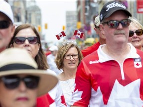 There was plenty of red and white to be seen, including Sandra Martone's flag antennae, during Canada Day celebrations at Dundas Place in London on Friday, July 1, 2022. (Derek Ruttan/The London Free Press)