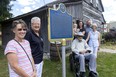 Area descendants of Peter Butler, who escaped slavery in the U.S. to become an original resident of the Wilberforce settlement in the 1820s, fete the installation of an updated plaque at the site in Lucan-Biddulph Township, north of London, Thursday. They are Wendy Hiscox, left, Marlene Thornton, Edward Butler and his wife Anneliese Butler. In back are Rachel Butler, holding daughter Brynn, and Rachel's husband, Allan Baxter. (Mike Hensen/The London Free Press)