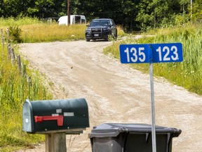Police are shown at a Jubilee Road address on Chippewa of the Thames First Nation, southwest of London, as officers investigate a suspicious death. 
Photograph taken on Wednesday July 20, 2022. Mike Hensen/The London Free Press