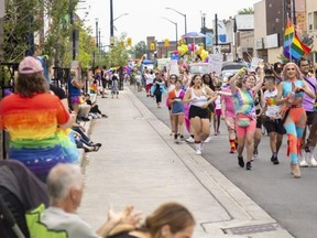 Large crowds poured into east London to watch the Pride Parade on Sunday.