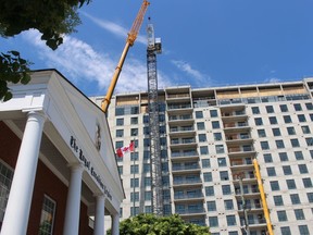 A tower crane is pictured here at a high-rise apartment construction project at 275 Front St. North in Sarnia on June 14, 2022.