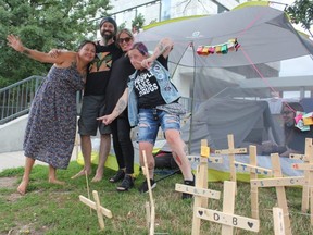 Jenna Rose Sands, Dan Oudshoorn, Andrea Sereda and Leticia Mizon (left to right), organizers with Forgotten 519, celebrate after reaching an agreement with City Hall marking the end of Oudshoorn's hunger strike, Friday, August 5, 2020. ( MEGAN STACEY/ The London Free Press)