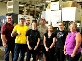 Stratford's Stackpole International auto-parts plant has brought over 10 Ukrainian refugees from its sister plant in Poland and helped resettle here. Pictured from left are Stackpole environmental health and safety specialist Scott Herman; Stackpole employees and housemates Mykhailo Komeranko, Oleksandr Buzenko, Mariana Vatamaniuk, Vladyslav Kucherenko, Alina Pianychuk and Valentyna Buzenko; and Stackpole human resources director Tara Ross. (Galen Simmons/Postmedia Network)