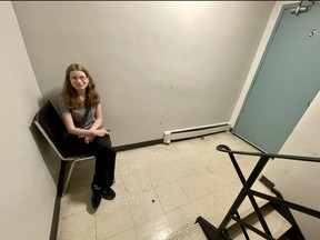 Amber Rankine sits on a chair in the fifth floor of her building at 470 Dundas St. that for the past six weeks has been without a working elevator following the strike of TSSA inspectors. The owner of the building has put chairs on each floor so tenants can rest. JONATHAN JUHA/The London Free Press