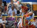 Cole, 12, of Walpole Island First Nation performs the grass dance during the Chippewas of the Thames 45th annual powwow at Chippewa Ball Park on Saturday Aug. 20, 2022. (Calvi Leon/The London Free Press)