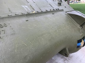Vandals scratched an obscure message into the side of the Holy Roller tank, Victoria Park's Second World War monument. Photo taken on Monday Aug. 29, 2022. (Mike Hensen/The London Free Press)