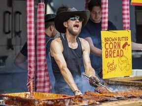 'Little Lou' Vincette of Ashby, N.C., grills ribs at Bubbalou's Bar.B.Q. at the London Ribfest and Craft Beer Festival in Victoria Park on Monday, Aug. 1, 2022. (Derek Ruttan/The London Free Press)