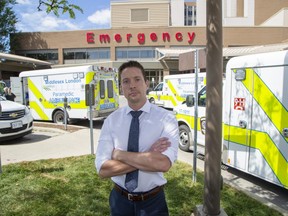 Jason Schinbein is president of OPSEU Local 147 which represents paramedics, says the inability to quickly offload patients and get ambulances back into service has reached a critical point. The emergency entrance at Victoria Hospital has dedicated parking bay for five ambulances, but when this photo was taken on Wednesday, Aug. 10, 2022, 13 ambulances were crowding the entrance. (Derek Ruttan/The London Free Press)
