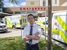 Jason Schinbein, president of OPSEU Local 147 which represents paramedics, says the inability to quickly offload patients and get ambulances back into service has reached a critical point. The emergency entrance at Victoria Hospital has dedicated parking bay for five ambulances, but when this photo was taken on Wednesday, Aug. 10, 2022, 13 ambulances were crowding the entrance. (Derek Ruttan/The London Free Press)