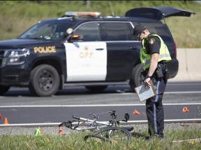 One person has been arrested after a bicyclist was struck and killed by a vehicle in the eastbound lanes of Highway 401 just west Colonel Talbot Road in London on Thursday August 11, 2022. (Derek Ruttan/The London Free Press)