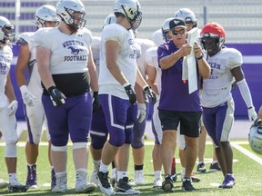 Head coach Greg Marshall instructs players during Western Mustangs football practice at TD Stadium in London on Wednesday August 24, 2022. (Derek Ruttan/The London Free Press)