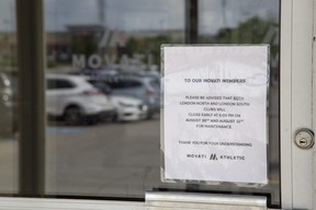 Movati Atheltic posted a notice for members on the door of its Wonderland Road South gym in London on Aug. 30, 2022. (Derek Ruttan/The London Free Press)