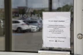 Movati Atheltic posted a notice for members on the door of its Wonderland Road South gym in London on Aug. 30, 2022. (Derek Ruttan/The London Free Press)