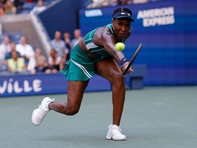 Venus Williams hits a return to Alison van Uytvanck during their U.S. Open women's singles first round match at the USTA Billie Jean King National Tennis Center in New York City, Tuesday, Aug. 30, 2022.