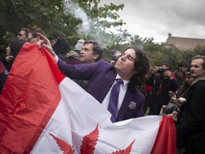 People gather at a Toronto park for a "smoke out" as Canada became the second country in the world after Uruguay and the first G7 nation to legalize cannabis use, on October 17, 2018.