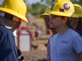 John Weekes takes direction from an instructor while participating in a hands-on home construction program on Tuesday, Sept. 20, 2022, at the site of a new affordable housing project at Chippewas of the Thames First Nation. Weekes is one of 19 members helping to build two micro-homes that will be used for housing on the First Nation. (Calvi Leon/The London Free Press)