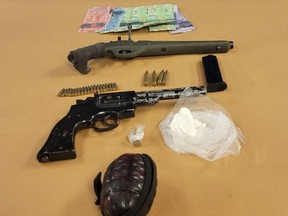 Two Londoners face charges after London police seized guns, ammunition and drugs, shown here, from a home on Vermont Avenue Thursday morning. (London police photo)