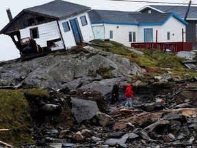 People head to their homes in the aftermath of Hurricane Fiona in Burnt Islands, N.L. (John Morris/Reuters)