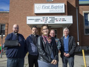 Kevin George, left, rector of St. Aidan's Anglican Church; Joshua Lawrence, minister at First-St. Andrew's United Church; Sarah Campbell, executive director of Ark Aid Street Mission; Alan Roberts, pastor at First Baptist Church on the Park, and Ed Wilson, chair of the board of Ark Aid Street Mission, are not happy that city hall wants them to stop helping homeless people at First Baptist Church on the Park after getting a bylaw complaint. Photo shot in London on Friday, Sept. 23, 2022. (Derek Ruttan/The London Free Press)