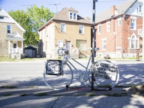 A ghost bike memorial has been erected for  Jibin Benoy, a cyclist who was killed in a hit-and-run crash on September 18. The memorial is set up where he was struck on Hamilton Road near Little Grey Street. Photo shot  inLondon, Ont. on Thursday September 29, 2022. (Derek Ruttan/The London Free Press)
