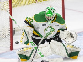London Knight goalie Brett Brochu stops a shot by Deni Goure of  the Owen Sound Attack during the first period of their game against at Budweiser Gardens in London on Friday September 30, 2022. Derek Ruttan/The London Free Press/Postmedia Network