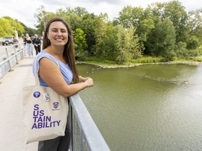 Jessica Cordes, Western University's engagement co-ordinator, stands on the University Bridge overlooking the north branch of the Thames on Monday, Sept. 12, 2022. Western plans a series of event to celebrate the river running through campus. (Mike Hensen/The London Free Press)