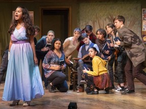 Stella Yanga, who plays the witch, sings as Isaac Szoldatits, who plays the narrator, lapses into silence in Into the Woods, the Grand Theatre's High School Project. Photograph taken on Tuesday, Sept. 20, 2022.  (Mike Hensen/The London Free Press)