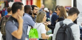 It's often the first stop for people looking for work and newcomers to Canada, says Ariana Pilolli, right, of Pathways to Employment Help Center.  Pilolli speaks to people attending the job fair Tuesday, September 20, 2022, at the White Oaks Mall organized by the London Economic Development Corp.  Mike Hensen / The London Free Press