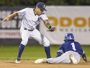 London Majors shortstop Keith Kandel is late with the tag as Jose Vinicinio of the Toronto Maple Leafs easily gets a stolen base during the Intercounty Baseball League finals. Photograph taken at Labatt Park in London on Tuesday September 20, 2022.  (Mike Hensen/The London Free Press)