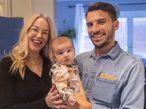 David Ferreira, right, who's running for Ward 13 in London, and his wife Claire Hodder hold their three-month-old daughter Eloise Ferreira. Photograph taken on Thursday, Sept. 22, 2022. (Mike Hensen/The London Free Press)