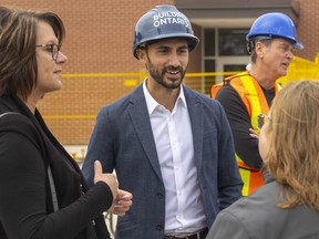 Ontario Education Minister Stephen Lecce talks with Thames Centre's deputy mayor, Kelly Elliott, and Thames Valley District school board trustee Arlene Morell, left, while in Dorchester to announce millions in additional cash for the construction of a new childcare centre on Monday September 26, 2022. 
Mike Hensen/The London Free Press/Postmedia Network