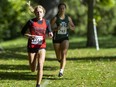 Charlotte Piscione of Woodstock CI leads Charlotte Cromack of Mother Teresa near the end of the junior girls 5.2-kilometre cross-country race at the Banting Invitational held at Springbank Park in London on Thursday, Sept. 29, 2022. Piscione held on for first and Cromack finished second. (Mike Hensen/The London Free Press)