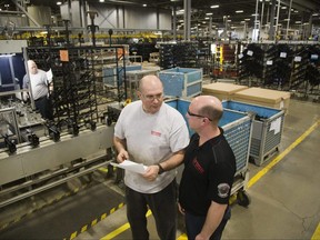 Workers are shown on the factory floor at Brose Canada Inc. in London in this file photo taken Jan. 8, 2016. (Derek Ruttan/The London Free Press)