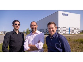 Aspire chief operator Gabe Mott, left, chief executive Mohammed Ashour and chief financial officer Craig Sifton stand outside the company's massive new cricket protein factory in London on Thursday, Sept.  15, 2022 after Aspire announced a multimillion-dollar contract to supply crickets to a South Korean snack maker.  (Mike Hensen/The London Free Press)