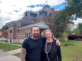 Arryn and Heather Blumberg are seen in front of a former funeral home they bought in Dresden. Their renovation of the 38-room home will be the focus of a six-part series We Bought A Funeral Home that debuts Saturday on Discovery. (Ellwood Shreve/Postmedia Network)