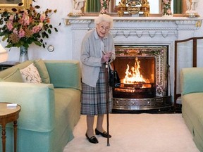 In this file photo taken Sept. 6, 2022, Queen Elizabeth II waits to meet with new Conservative Party leader and Britain's Prime Minister-elect at Balmoral Castle in Ballater, Scotland.