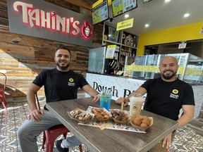 Tahini's owner Aly Hamam, left, and his brother Omar Hamam, show some of the food being sold under their new Dough Bits brand, a new Middle Eastern dessert business launched by the London-based restaurant company. JONATHAN JUHA/The London Free Press