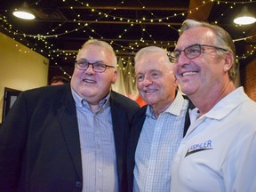 St. Thomas Mayor Joe Preston, left, and city councillors Jim Herbert, middle, and Jeff Kohler celebrate their victories at St. Thomas Roadhouse Bar and Grill on Talbot Street. Preston won the mayoral seat in Monday's municipal election, defeating former two-term mayor Heather Jackson by more than 2,600 votes in a three-candidate race. (Calvi Leon/The London Free Press)
