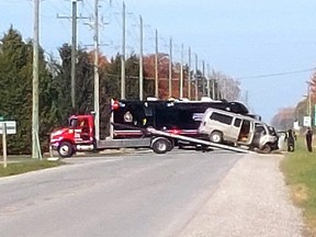 A passenger van was pulled from a deep ditch at intersection of Fairview Line and Kent Bridge Road Sunday. Police had the roadway closed off until around 1 p.m. as they investigated the crash that was called in around 7 a.m. PHOTO Ellwood Shreve/Chatham Daily News