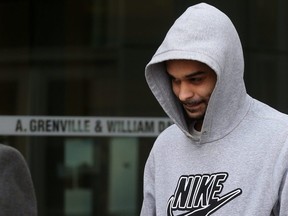 Ronjot Singh Dhami leaves the Brampton courthouse with his lawyer on Nov. 28, 2018, after pleading guilty to aggravated assault in the beating of an autistic man at a Mississauga bus terminal. Dave Abel/Toronto Sun