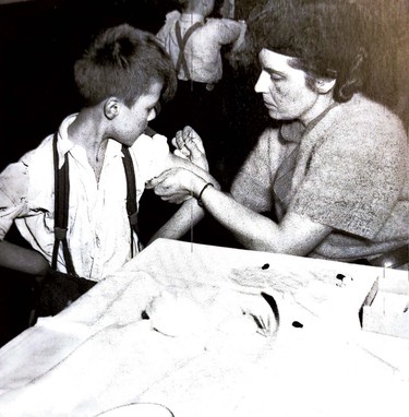 A child receives a vaccine for smallpox in this Jan. 4, 1939 photo. Supplied