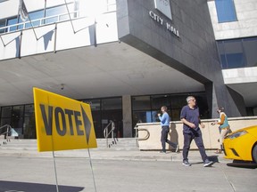 People come and go at London city hall where a polling station for the municipal election was operating on Monday October 24, 2022. (Derek Ruttan/The London Free Press)