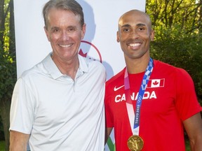 Jeff Fischer poses with London decathlete Damian Warner in London in this Free Press file photo. Fischer, who was an agent for Warner and other top athletes in London, died Saturday, Oct. 15.