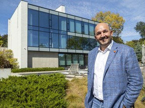 Shahin Tabeshfard, the Century 21 broker of record for the $5.3-million sale of a home at 2-756 Riverside Dr., says doctors and businesspeople are more comfortable now spending seven figures on London homes. He was photographed on Monday, Oct. 3, 2022, in the backyard of the Riverside Drive home. (Mike Hensen/The London Free Press)