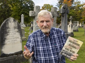 London author and journalist Brian 'Chip' Martin stands in Woodland Cemetery, where the Labatt (column in background), Harris, and other families of note have headstones. Nearby are the graves of rebel slave owners from South Carolina who fled to London after the U.S. Civil War. Martin’s new book examines the little-known links to Canada from the U.S. Civil War. (Mike Hensen/The London Free Press)