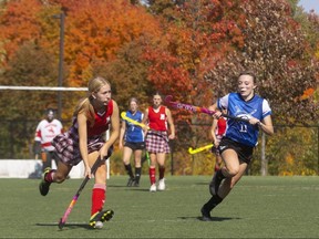 Medway's Erika Steele carries the ball up field while being pursued by Parkside's Cadence Hardwick during a close game between two of the top TVRA girls field hockey teams at City Wide Fields in London on Tuesday, Oct. 12, 2022. Medway won 1-0 to remain undefeated at 9-0. (Mike Hensen/The London Free Press)