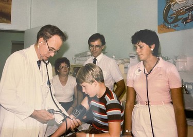 A doctor checks a young boy's blood pressure in this undated photo. Supplied