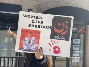 In one of many demonstrations held around the world to show solidarity with the people of Iran, protesters lined Yonge Street chanting, “Women, life, freedom,” on Saturday, Jan. 29, 2022.