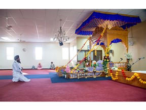 Gurmukh Singh prays at the London Sikh Society's Gurdwara Sahib in London on Thursday. Although they represent a very small portion of the population, the number Sikhs grew exponentially during the past decade in London, according to new census data. (Derek Ruttan/The London Free Press)